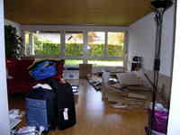 This is a snapshot of the living room at the new place. The boxes on the floor are from the new wardrobe, the desk and the shelves.