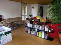 The messy living room from the other perspective. Please notice the most important thing: the novels and books have been taken care of.
